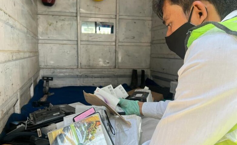 A person collecting e-waste